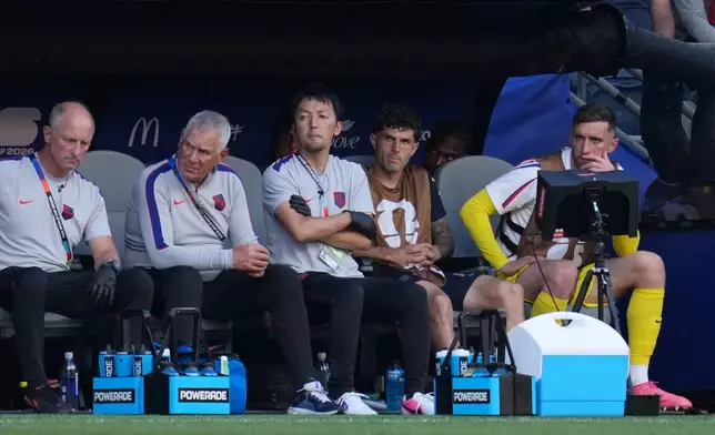 United States' Christian Pulisic, second from right, watches from the bench during the World Cup round of 16 soccer match between the United States and Belgium in Seattle, Monday, July 6, 2026. (AP Photo/Abbie Parr)