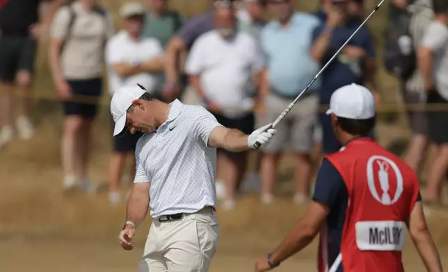 Rory McIlroy of Northern Ireland reacts after playing a shot to the 2nd green during the second day of the British Open Golf championships at Royal Birkdale golf club, in Southport, England, Friday, July 17, 2026. (AP Photo/Peter Morrison)