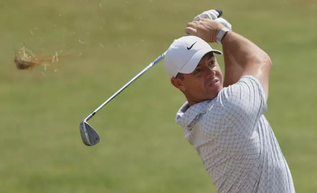 Rory McIlroy of Northern Ireland play a shot from the light round on the 7th during the second day of the British Open Golf championships at Royal Birkdale golf club, in Southport, England, Friday, July 17, 2026. (AP Photo/Peter Morrison)