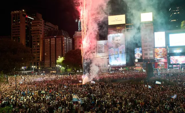 Fans celebrate Argentina's victory over England in a World Cup semifinal soccer match in downtown Buenos Aires, Argentina, Wednesday, July 15, 2026. (AP Photo/Rodrigo Abd)
