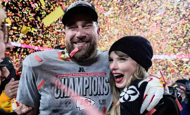 FILE - Travis Kelce, left, and Taylor Swift pose after the AFC Championship NFL football game against the Buffalo Bills, Jan. 26, 2025, in Kansas City, Mo. (AP Photo/Ashley Landis, File)