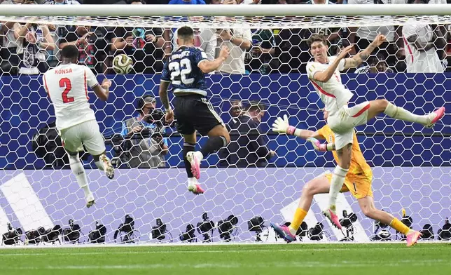 Argentina's Lautaro Martinez (22) scores their second goal during the World Cup semifinal soccer match between England and Argentina in Atlanta, Wednesday, July 15, 2026. (AP Photo/Jeff Roberson)