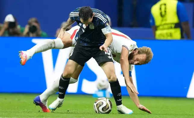 England's Harry Kane, right, vies for the ball with Argentina's Lionel Messi during the World Cup semifinal soccer match between England and Argentina in Atlanta, Wednesday, July 15, 2026. (AP Photo/Rebecca Blackwell)