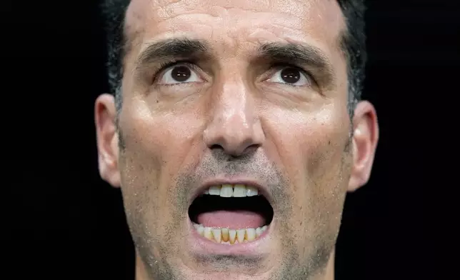 Argentina head coach Lionel Scaloni sings the national anthem before the World Cup semifinal soccer match between England and Argentina in Atlanta, Wednesday, July 15, 2026. (AP Photo/Rebecca Blackwell)