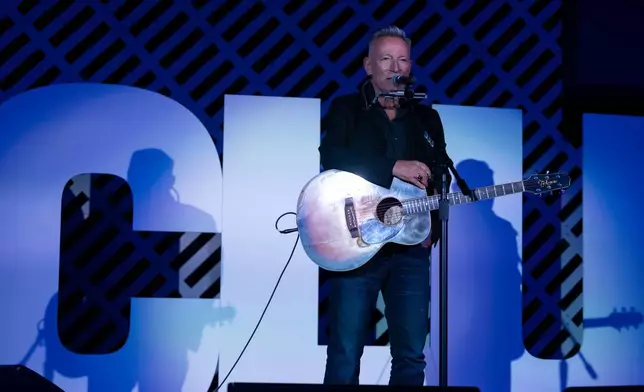 Bruce Springsteen performs on stage after recieving the ACLU Ralph Ellison Award for Defenders of Civil Rights and Civil Liberties in the Arts, Business, Science, and Sports at the ACLU's 2026 Biennial Leadership Conference,Friday, July 24, 2026, in Washington. (AP Photo/Kevin Wolf)