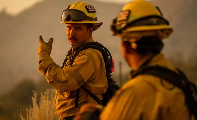 Firefighters work on the Summit Fire in Llano, CA. Friday, July 10, 2026. (AP Photo/Ethan Swope)