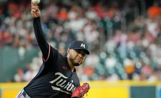 Minnesota Twins starting pitcher Taj Bradley throws against the Houston Astros during the first inning of a baseball game Wednesday, July 1, 2026, in Houston. (AP Photo/David J. Phillip)
