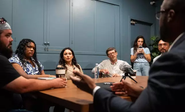 Democratic candidate for Texas governor Gina Hinojosa, third from the left, listens to Stephen Sanders, right, during a roundtable discussion on data centers, Saturday, July 18, 2026, in Lubbock, Texas. (AP Photo/Justin Rex)