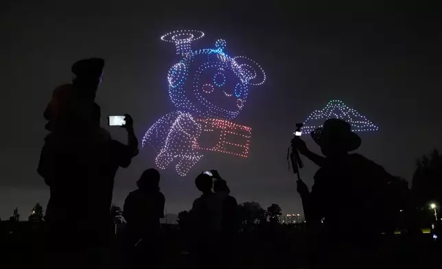 Drones light up the night sky during the K-Drone Festival at a park in Incheon, South Korea, Wednesday, July 15, 2026. (AP Photo/Ahn Young-joon)