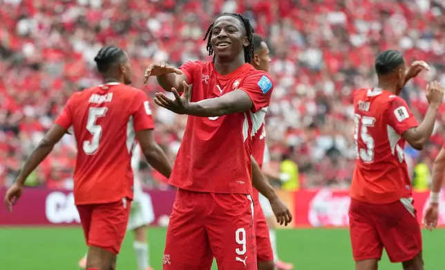 Switzerland's Johan Manzambi (9) celebrates after scoring during the World Cup Group B soccer match between Switzerland and Canada in Vancouver, British Columbia, Wednesday, June 24, 2026. (AP Photo/Abbie Parr)