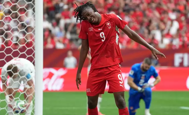 Switzerland's Johan Manzambi (9) celebrates after scoring during the World Cup Group B soccer match between Switzerland and Canada in Vancouver, British Columbia, Wednesday, June 24, 2026. (AP Photo/Abbie Parr)