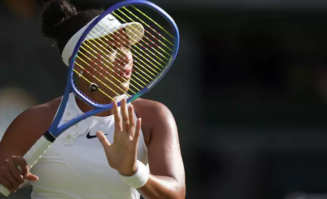 Naomi Osaka of Japan eyes the ball as she prepares to play a forehand against Aryna Sabalenka of Belarus in their fourth round women's singles match at the Wimbledon Tennis Championships in London, Sunday, July 5, 2026. (AP Photo/Brian Inganga)