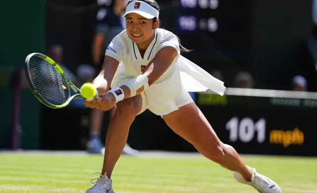 Alexandra Eala of the Philippines plays a return during the women's singles fourth round match against Jasmine Paolini of Italy at the Wimbledon Tennis Championships in London, Monday, July 6, 2026.(AP Photo/Kirsty Wigglesworth)