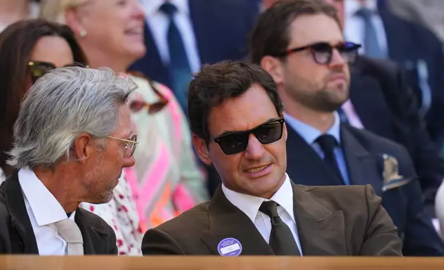 Former tennis player Roger Federer of Switzerland sits in the Royal Box on day eight at the Wimbledon Tennis Championships in London, Monday, July 6, 2026.(AP Photo/Kirsty Wigglesworth)