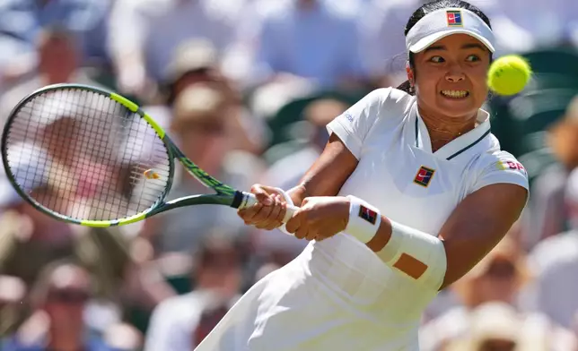 Alexandra Eala of the Philippines plays a return during the women's singles fourth round match against Jasmine Paolini of Italy at the Wimbledon Tennis Championships in London, Monday, July 6, 2026.(AP Photo/Kirsty Wigglesworth)