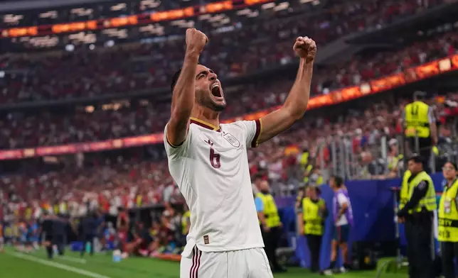 Spain's Mikel Merino (6) celebrates scoring his side's opening goal during the World Cup round of 16 soccer match between Portugal and Spain in Arlington, Texas, near Dallas, Monday, July 6, 2026. (AP Photo/Julio Cortez)