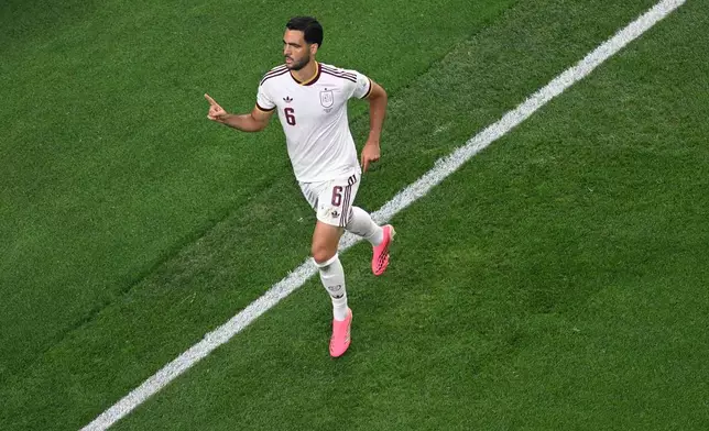 Spain's Mikel Merino (6) celebrates after scoring the opening goal during the World Cup round of 16 soccer match between Portugal and Spain in Arlington, Texas, near Dallas, Monday, July 6, 2026. (AP Photo/Jessica Tobias)