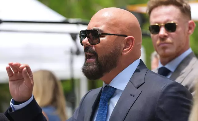 Attorney Joseph McBride, representing Andrew and Tristan Tate after they were arrested to face rape and sex trafficking charges against them in the United Kingdom, speaks with the news media outside of the C. Clyde Atkins U.S. Courthouse, Monday, July 20, 2026, in Miami. (AP Photo/Lynne Sladky)