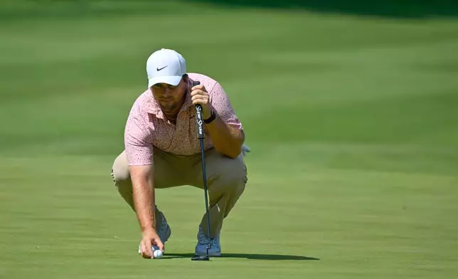 Chris Gotterup lines up a putt on the 18th hole during the final round of the John Deere Classic golf tournament, Sunday, July 5, 2026, in Silvis, Ill. (AP Photo/Matt Marton)