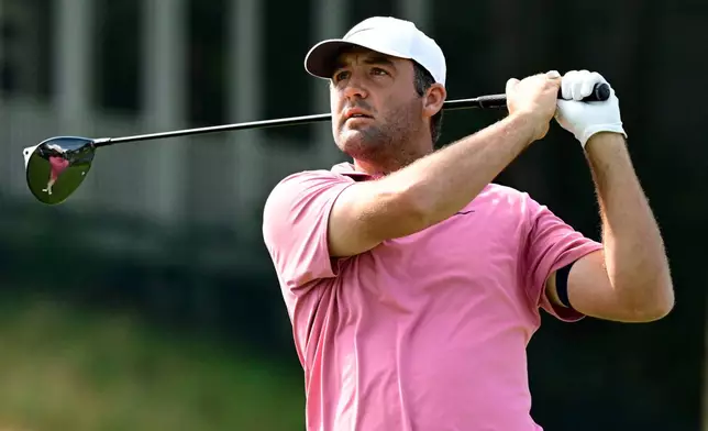 Scottie Scheffler tees off the first playoff hole of the Travelers Championship golf tournament at TPC River Highlands, Monday, June 29, 2026, in Cromwell, Conn. (AP Photo/Jessica Hill)