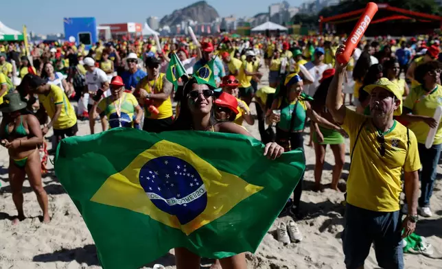 Brazil soccer fans gather on Copacabana Beach to watch the World Cup soccer match between Brazil and Japan, in Rio de Janeiro, Brazil, Monday, June 29, 2026. (AP Photo/Bruna Prado)