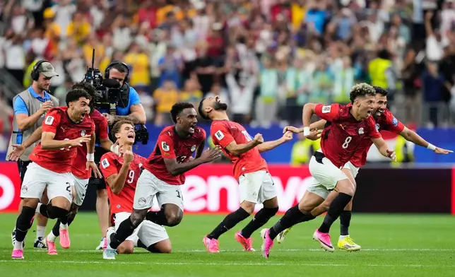 Egypt players celebrates winning a penalty shootout against Australia during the World Cup round of 32 soccer match in Arlington, Texas, near Dallas, Friday, July 3, 2026. (AP Photo/Tony Gutierrez)