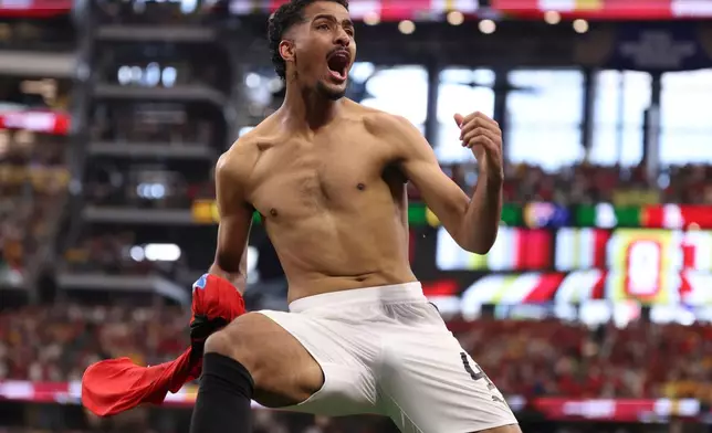 Egypt's Hossam Abdelmaguid (4) celebrates after scoring the winning penalty in a shootout during World Cup round of 32 soccer match between Australia and Egypt in Arlington, Texas, near Dallas, Tuesday, Friday, July 3, 2026. (AP Photo/Sam Hodde)