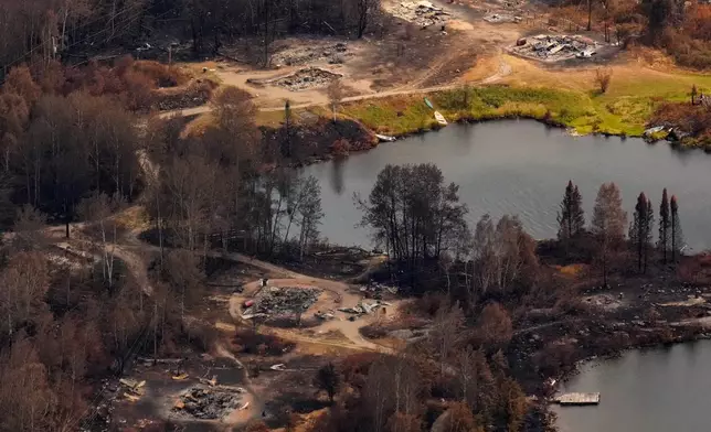 FILE - Debris from wildfire damage is visible at Collins First Nation in northwestern Ontario, Canada, July 22, 2026. (Chris Young/The Canadian Press via AP, File)