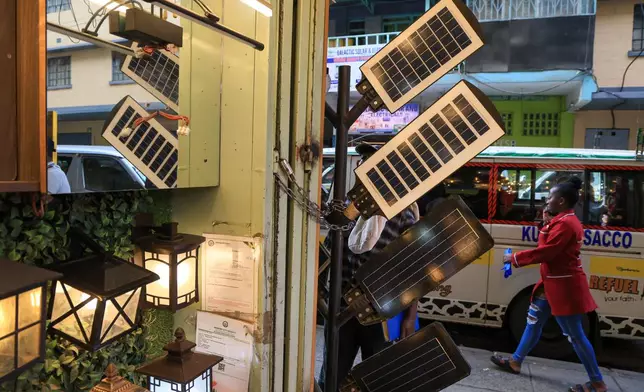 Solar-powered street lights are displayed for sale in Nairobi, Kenya, Tuesday, July 16, 2026. (AP Photo/Andrew Kasuku)