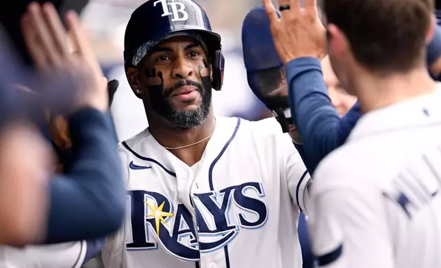 Tampa Bay Rays' Yandy Díaz celebrates after scoring on a double by Jonathan Aranda, not pictured, during the third inning of a baseball game Saturday, July 11, 2026, in St. Petersburg, Fla. (AP Photo/Jason Behnken)