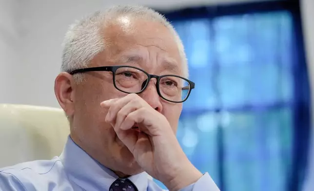 Chinese pastor Ezra Jin Mingri becomes emotional during an interview with The Associated Press in Maryland, Wednesday, July 22, 2026 . (AP Photo/Mariam Zuhaib)