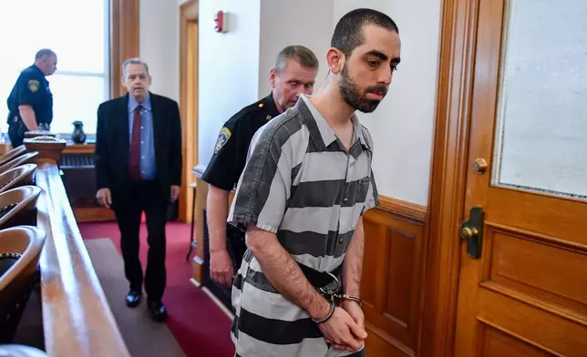 FILE - Hadi Matar walks in to the Chautauqua County court in Mayville, N.Y., May, 16, 2025. (AP Photo/Adrian Kraus, File)