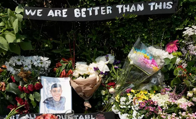 A portrait of Johan Sebastián Durán Guerrero, the man killed by U.S. Immigration and Customs Enforcement, is displayed among flowers and tributes at a makeshift memorial in Biddeford, Maine, Wednesday, July 15 2026. (AP Photo/Robert F. Bukaty)