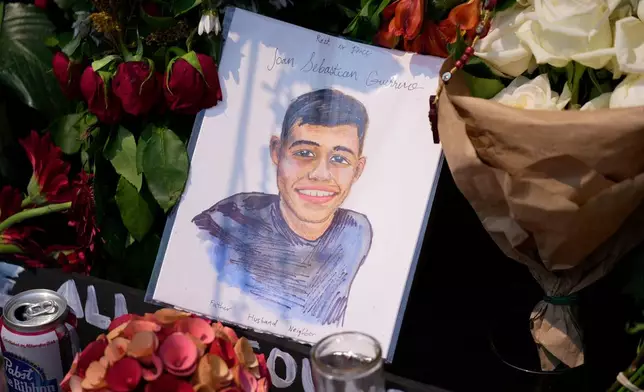 A portrait of Johan Sebastián Durán Guerrero, the man killed by U.S. Immigration and Customs Enforcement, is displayed among flowers and tributes at a makeshift memorial in Biddeford, Maine, Wednesday, July 15 2026. (AP Photo/Robert F. Bukaty)