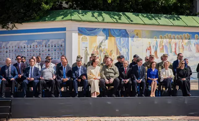 Ukrainian and EU officials attend a ceremony in Kyiv, Ukraine, Wednesday, July 15, 2026. (AP Photo/Dan Bashakov)