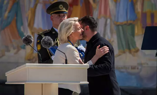 Ukrainian President Volodymyr Zelenskyy, right, greets European Commission President Ursula von der Leyen in Kyiv, Ukraine, Wednesday, July 15, 2026. (AP Photo/Dan Bashakov)