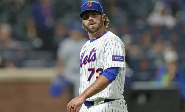 New York Mets pitcher Matt Seelinger reacts walking off the field during the seventh inning of a baseball game against the Kansas City Royals, Tuesday, July 7, 2026, in New York. (AP Photo/Adam Hunger)