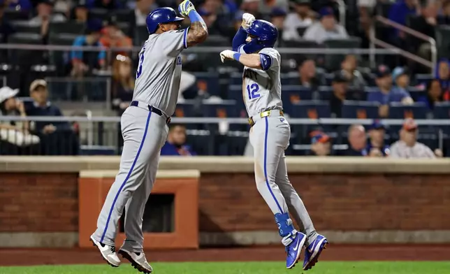 Kansas City Royals' Nick Loftin (12) celebrates his two-run home run with Salvador Perez during the seventh inning of a baseball game against the New York Mets, Tuesday, July 7, 2026, in New York. (AP Photo/Adam Hunger)