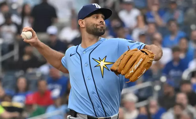 Tampa Bay Rays starting pitcher Nick Martinez throws to a Toronto Blue Jays batter during the first inning of a baseball game in Toronto, Monday, July 20, 2026. (Jon Blacker/The Canadian Press via AP)