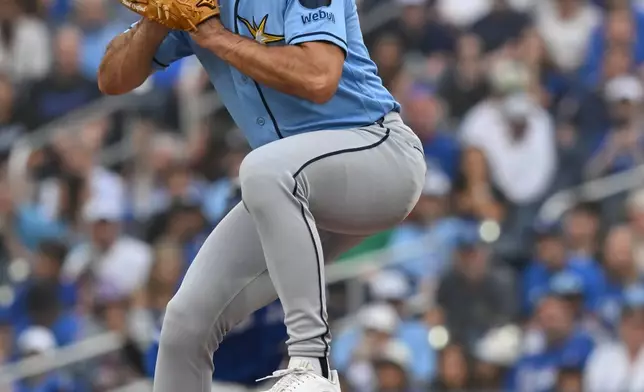 Tampa Bay Rays starting pitcher Nick Martinez throws to a Toronto Blue Jays batter during the first inning of a baseball game in Toronto, Monday, July 20, 2026. (Jon Blacker/The Canadian Press via AP)