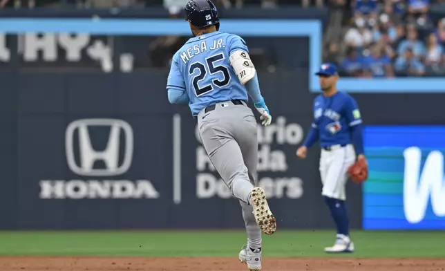 Tampa Bay Rays' Victor Mesa Jr. (25) runs the bases after hitting a solo home run against the Toronto Blue Jays during the second inning of a baseball game in Toronto, Monday, July 20, 2026. (Jon Blacker/The Canadian Press via AP)