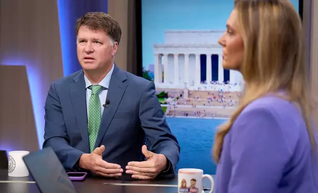 Ryan Grim, left, and Krystal Ball record a segment for the YouTube daily news show, Breaking Points, Monday, July 27, 2026, in Washington. (AP Photo/Jacquelyn Martin)