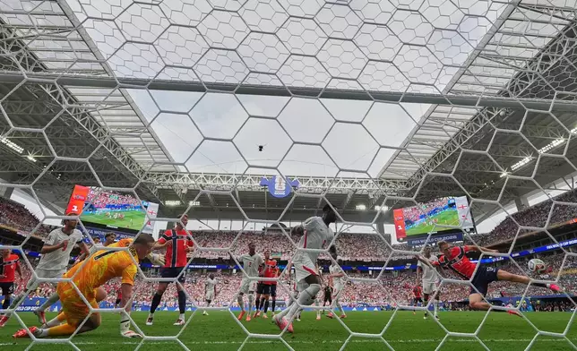 Norway's Torbjoern Heggem (17), right, scores a goal that was later disallowed during the World Cup quarterfinal soccer match between Norway and England in Miami Gardens, Fla., Saturday, July 11, 2026. (AP Photo/Rebecca Blackwell)