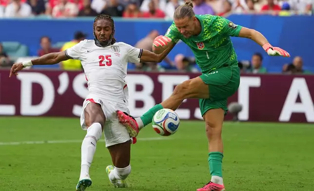 Norway goalkeeper Oerjan Nyland and England's Djed Spence vie for the ball during a World Cup quarterfinal soccer match in Miami Gardens, Fla., Saturday, July 11, 2026. (AP Photo/Julio Cortez)