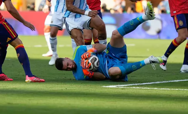 Spain goalkeeper Unai Simon makes a save during the World Cup final soccer match between Spain and Argentina in East Rutherford, N.J., near New York, Sunday, July 19, 2026. (AP Photo/Ashley Landis)