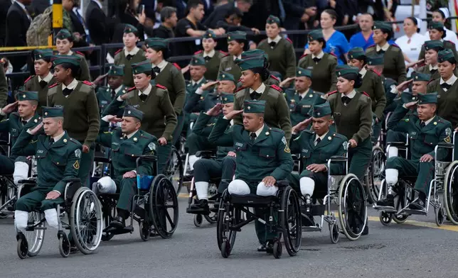 Military personnel who lost their limbs in the line of duty attend the parade marking Colombia's Independence Day in Bogota, Colombia, Monday, July 20, 2026. (AP Photo/Fernando Vergara)
