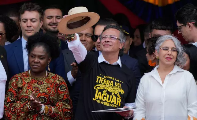 President Gustavo Petro addresses supporters, flanked by Vice President Francia Marquez, left, and Sen. Maria Jose Pizarro, right, after a military parade marking Colombia's Independence Day in Bogota, Colombia, Monday, July 20, 2026. (AP Photo/Fernando Vergara)