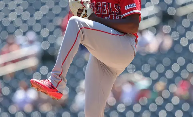 Los Angeles Angels starting pitcher José Soriano winds up to deliver during the first inning of a baseball game against the Minnesota Twins, Sunday, July 12, 2026, in Minneapolis. (AP Photo/Bailey Hillesheim)