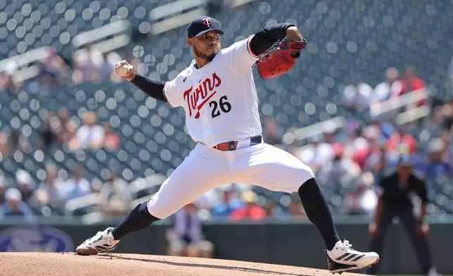 Minnesota Twins starting pitcher Taj Bradley delivers during the first inning of a baseball game against the Los Angeles Angels, Sunday, July 12, 2026, in Minneapolis. (AP Photo/Bailey Hillesheim)