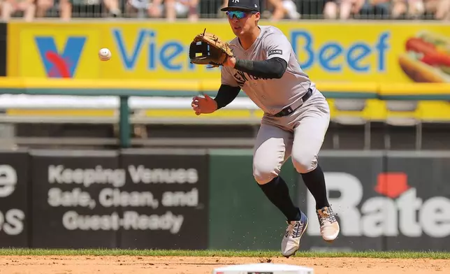 New York Yankees' Anthony Volpe fields a ground out hit by Chicago White Sox' Luisangel Acuña during the second inning, Thursday, July 30, 2026, in Chicago. (AP Photo/Melissa Tamez)